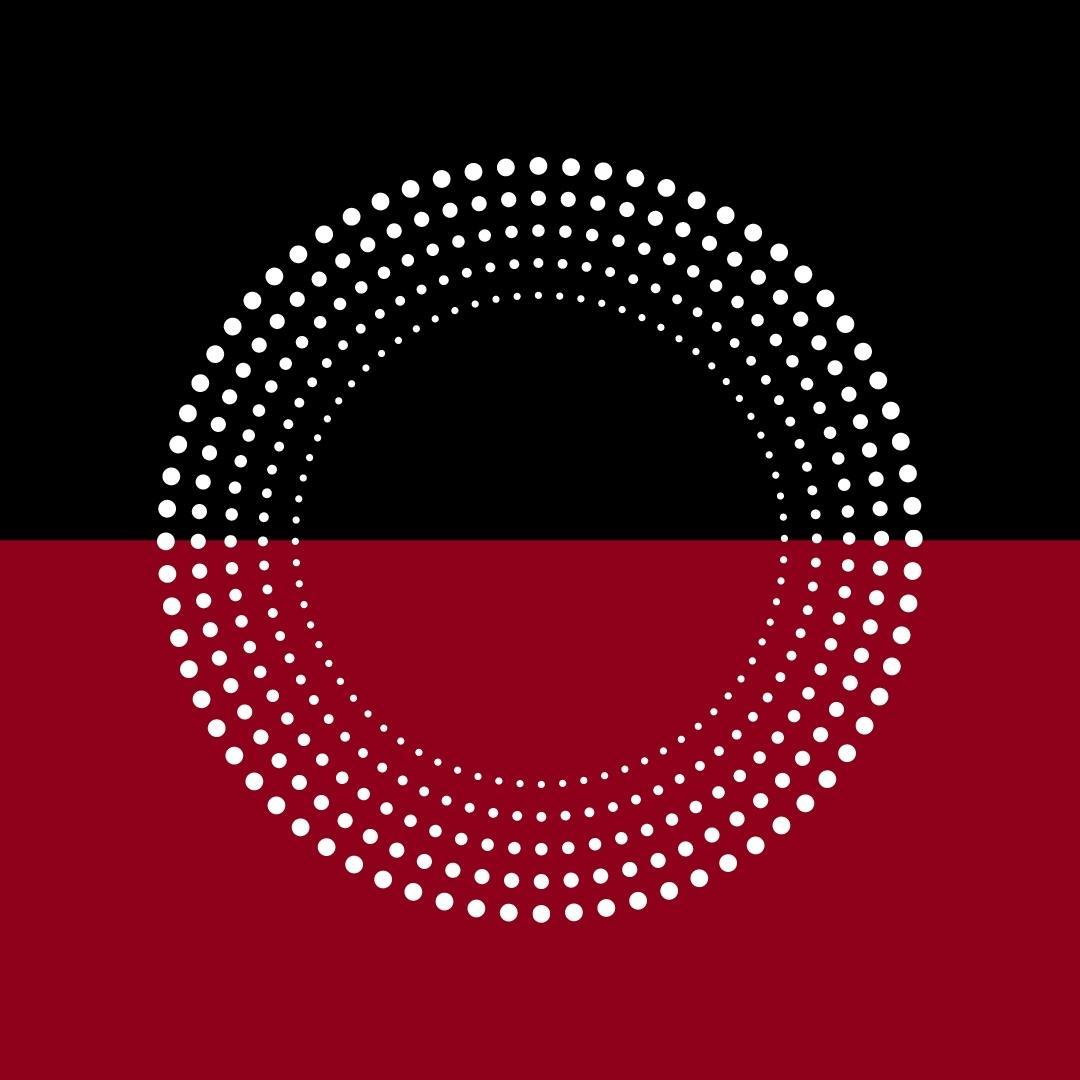 a wheel of white dots on a red and black bac