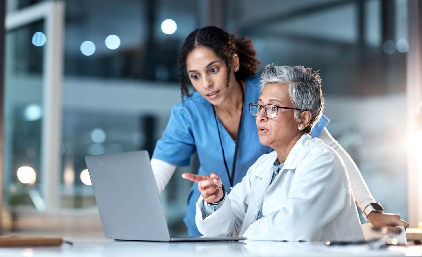 Doctors, nurse or laptop in night healthcare, planning research or surgery teamwork in wellness hospital