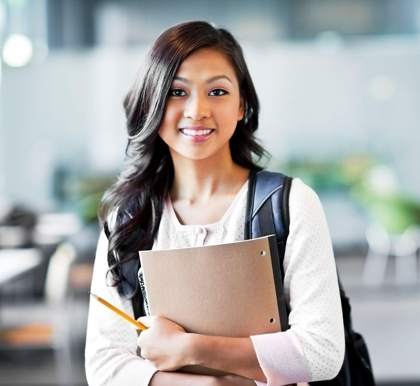 asian college student holding books