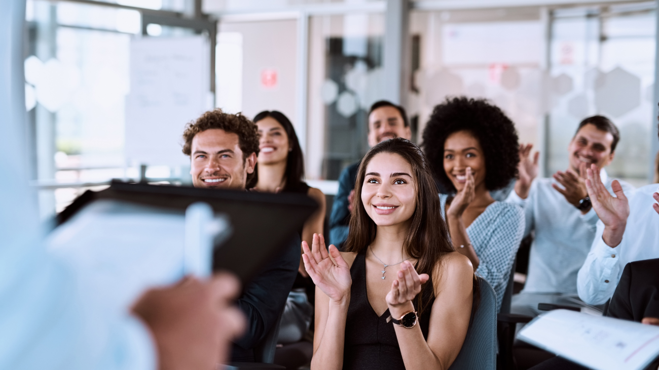 students in class applauding