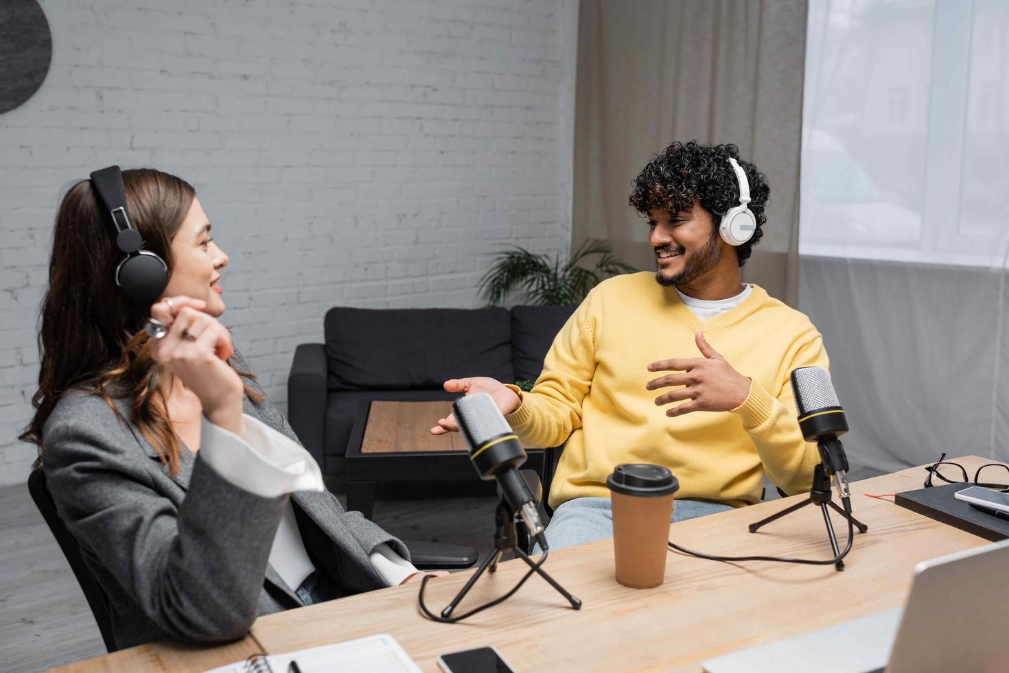 Two people recording a podcast