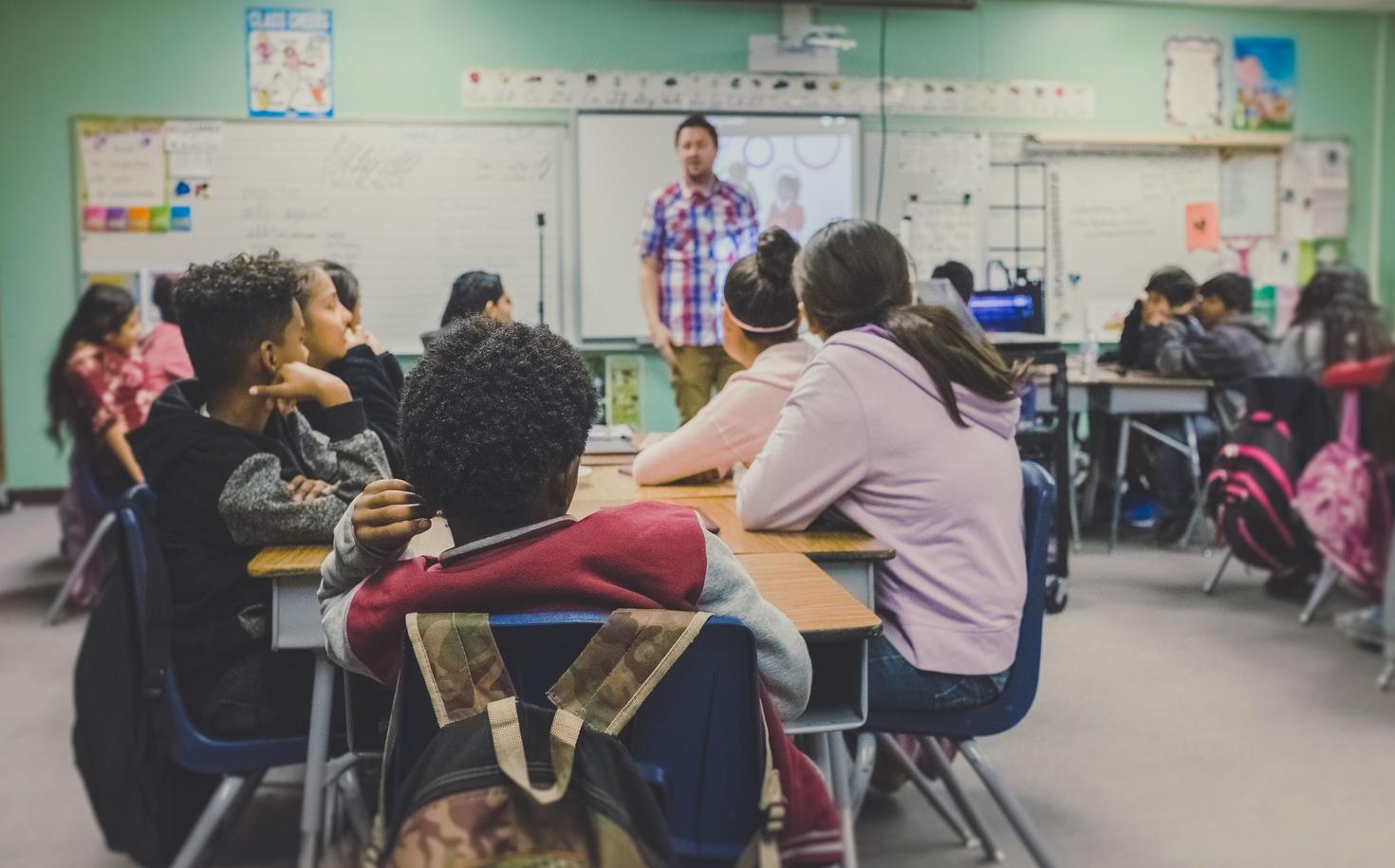Students listening to their teacher