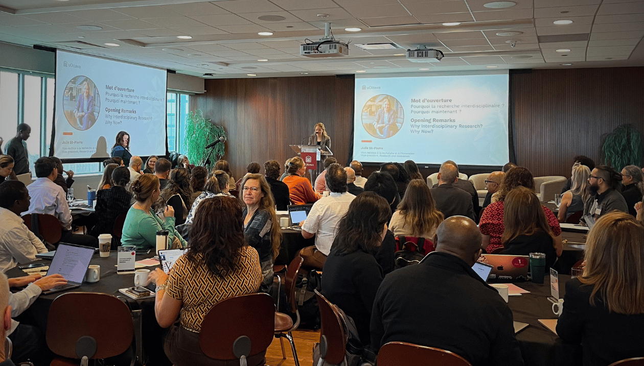 Julie St-Pierre speaks to a room full of University of Ottawa researchers