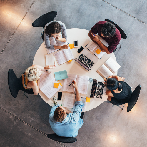 Group of students studying at a round table