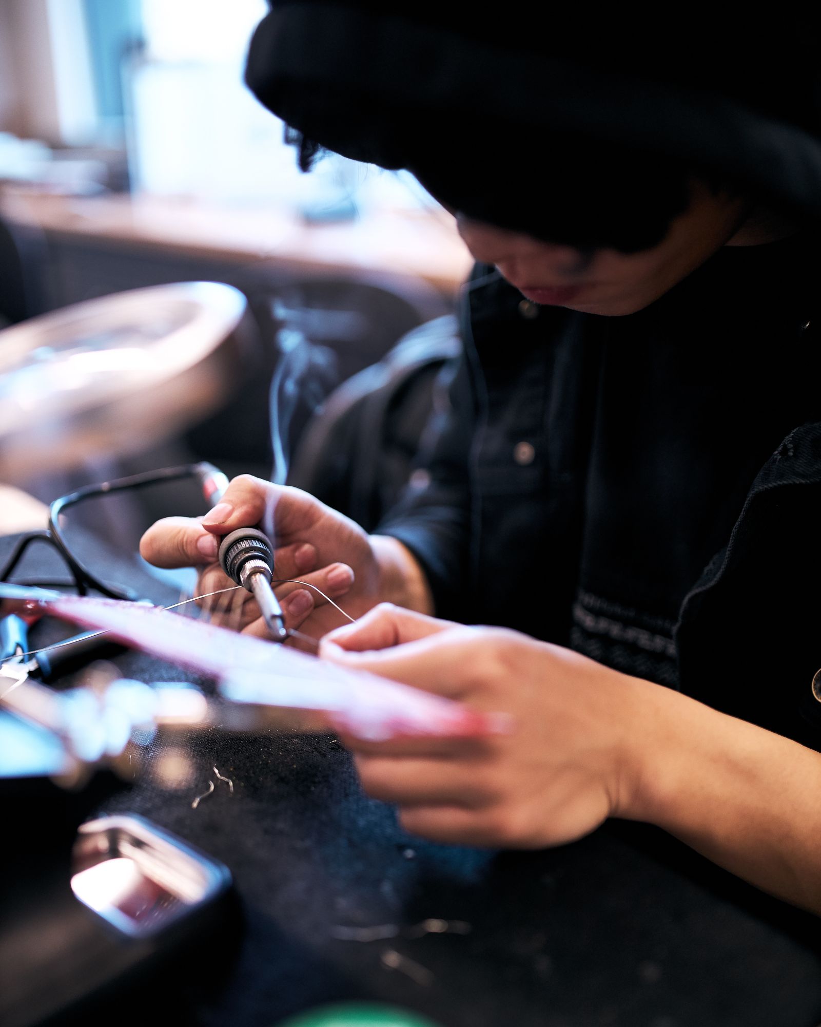 Student soldering in lab.