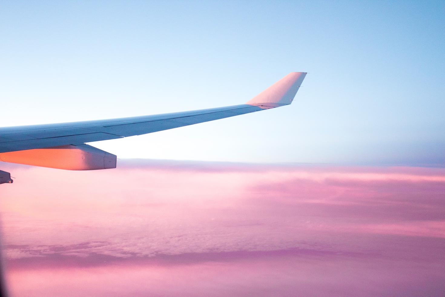 An airplane tail in the sky.