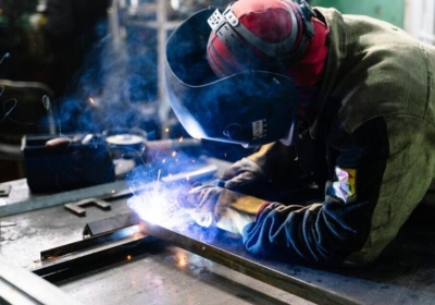 Engineering student welding in the workshop