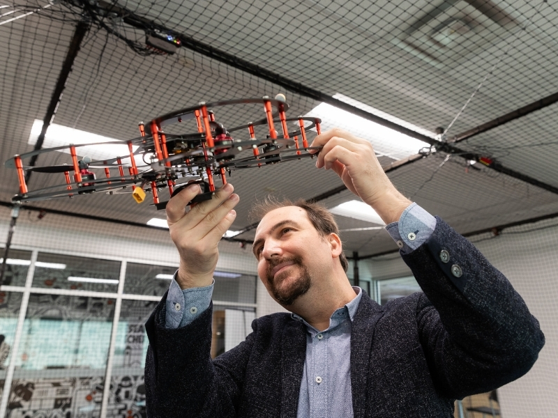 Burak Kantarci holding a drone.