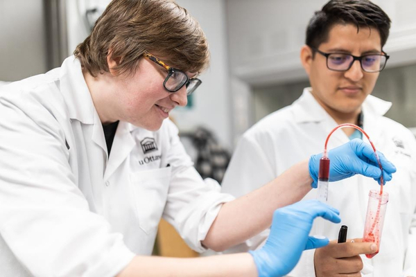 Two people in chemical and biological engineering lab.