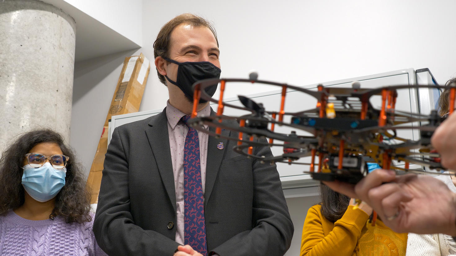 Professor and students with drone.