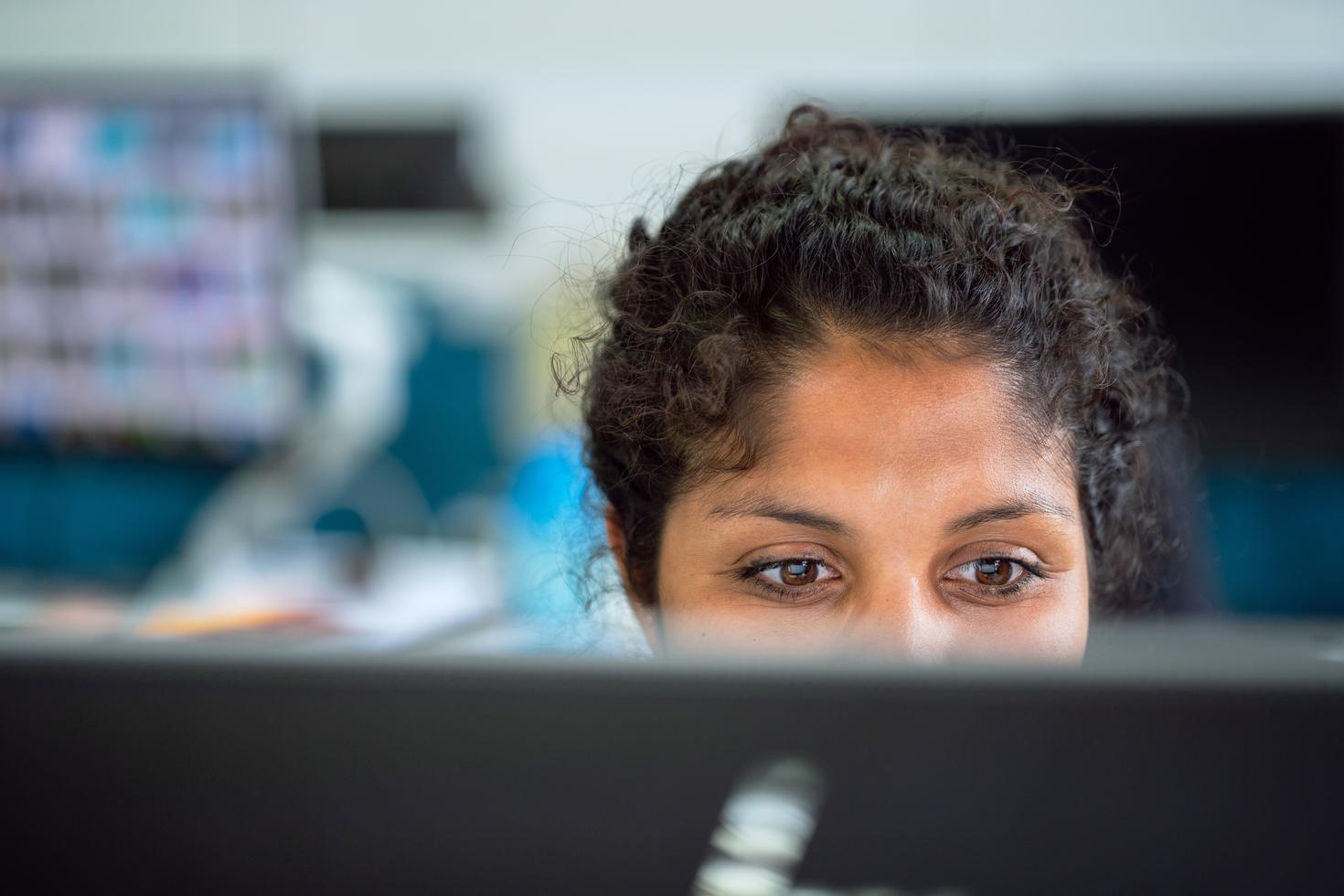 Student working on course work on their computer