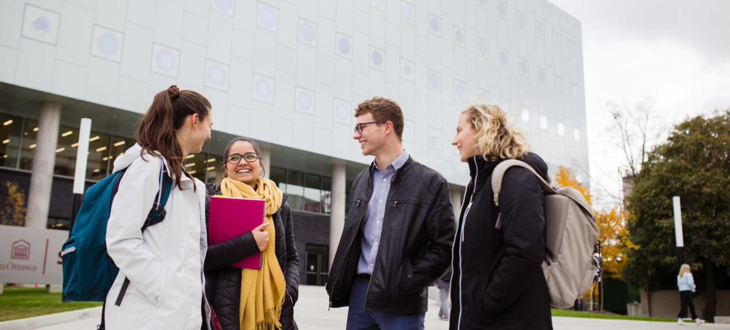 Students talking in front of STEM Complex.