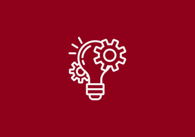 Lightbulb signaling an idea with gears turning.