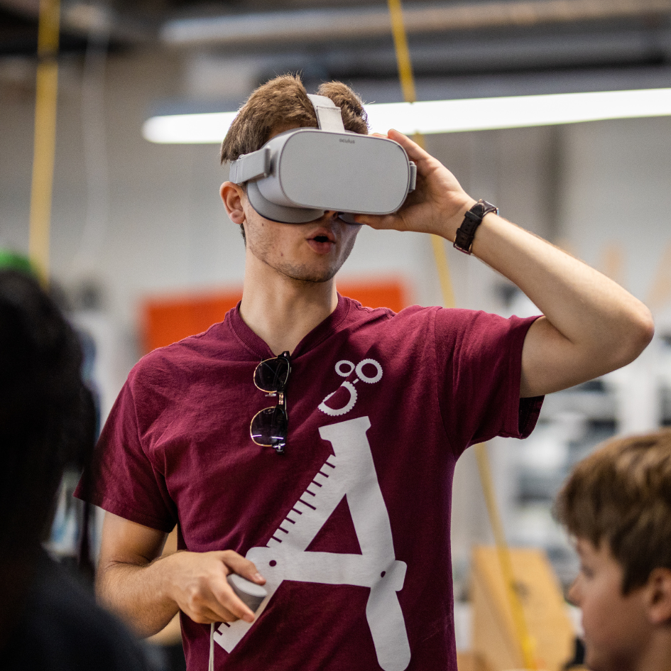 Teenager wearing Virtual Reality headset