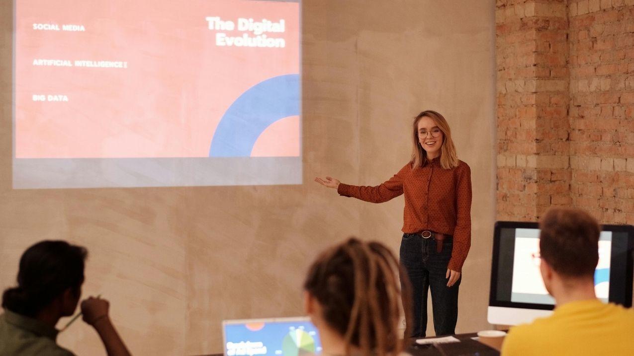 Woman giving a PowerPoint presentation.