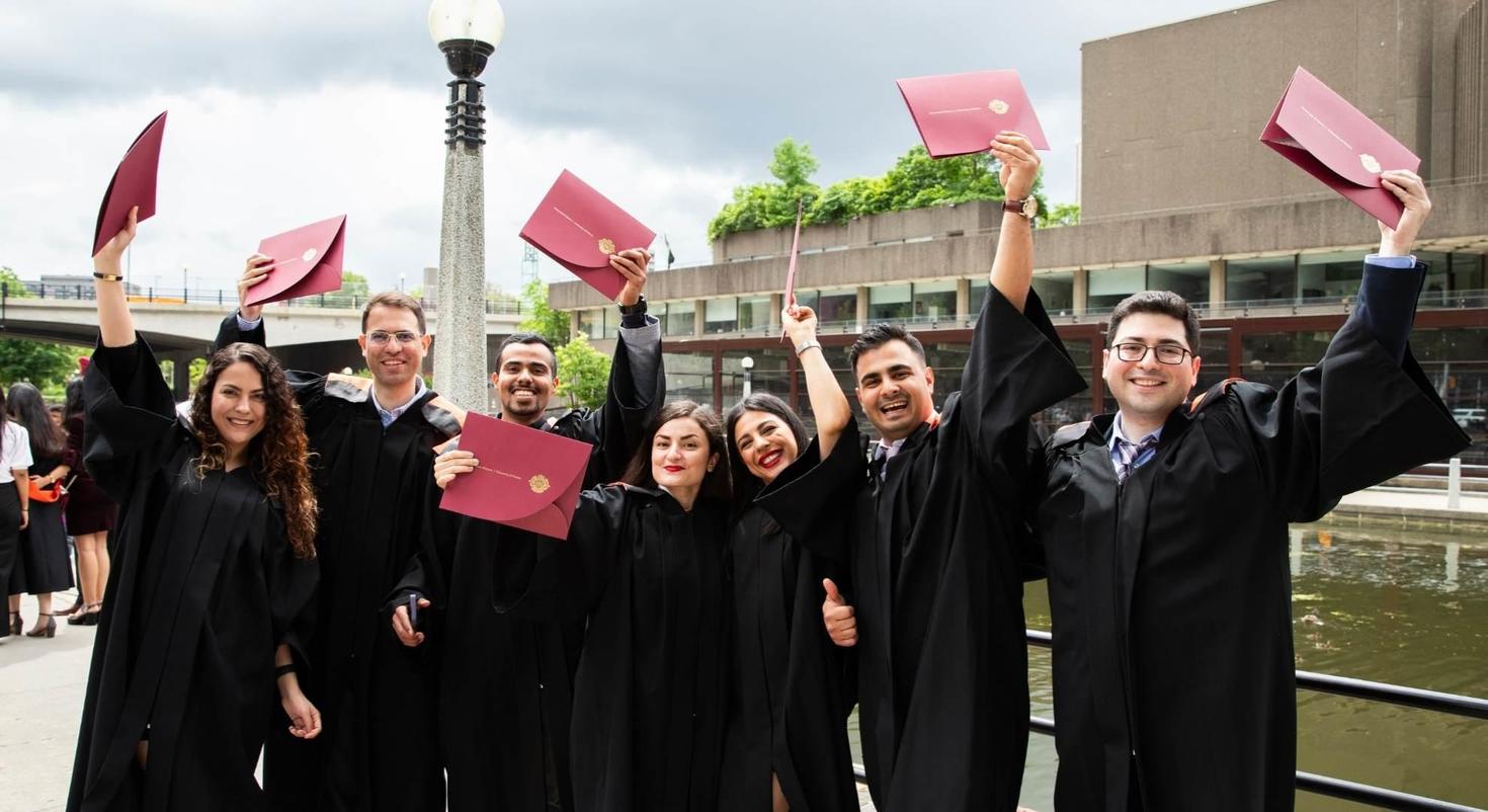 Students with their diplomas.
