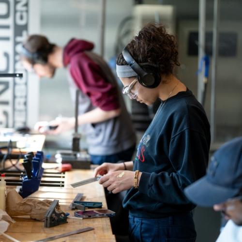 Two people working in the Brunsfield Centre.