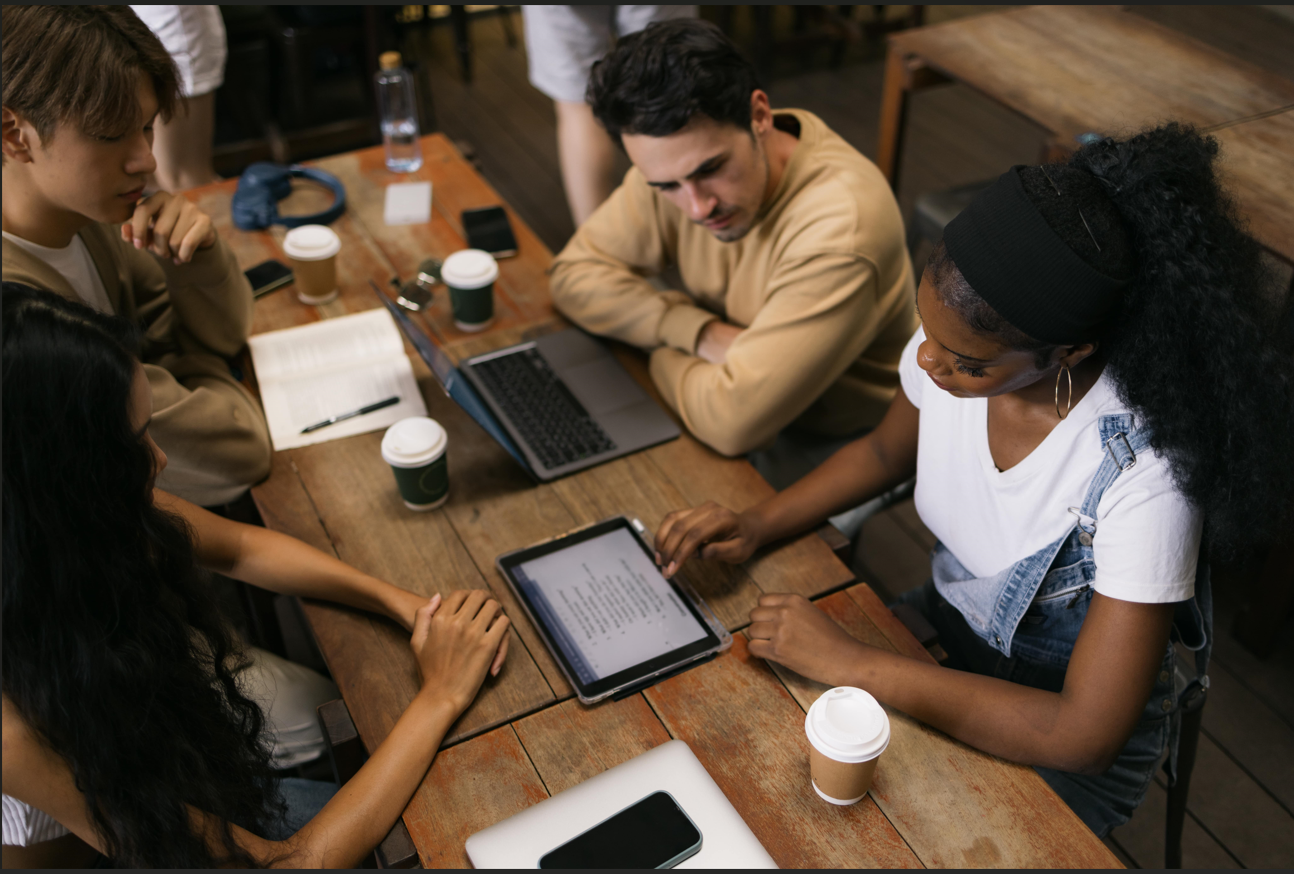 Four young people studying together