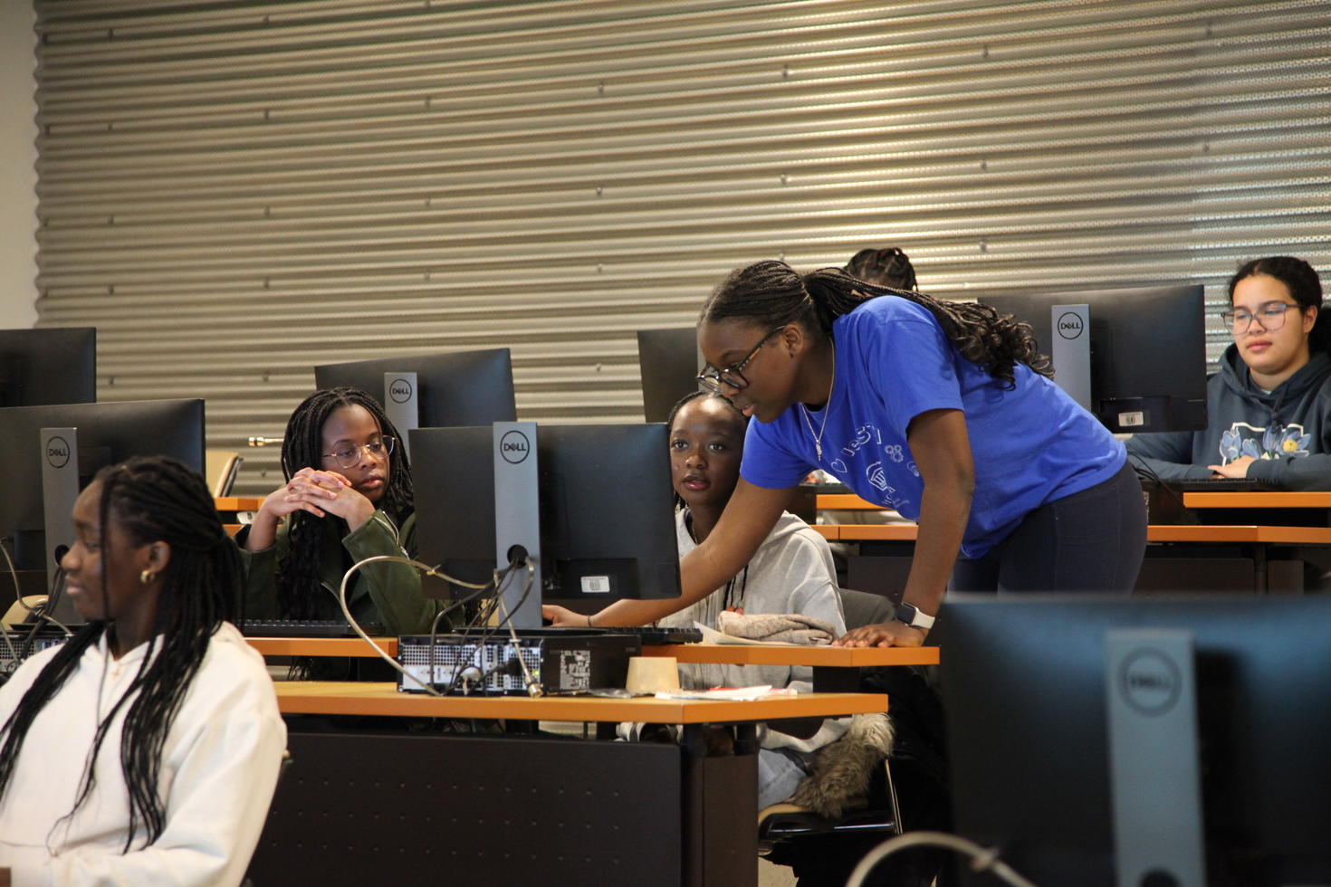 Student and teachers in a computer lab.
