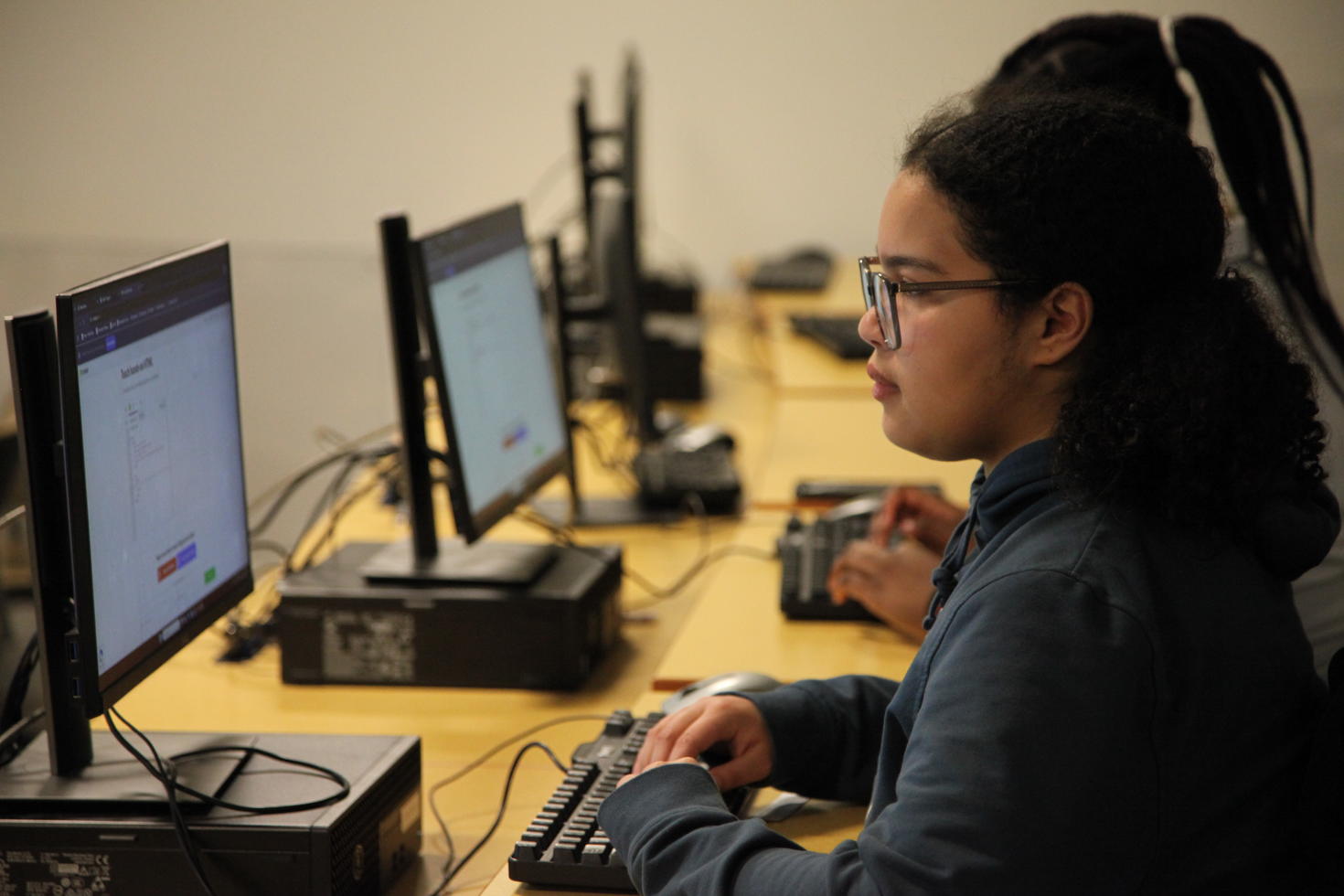 Girls working on a computers.