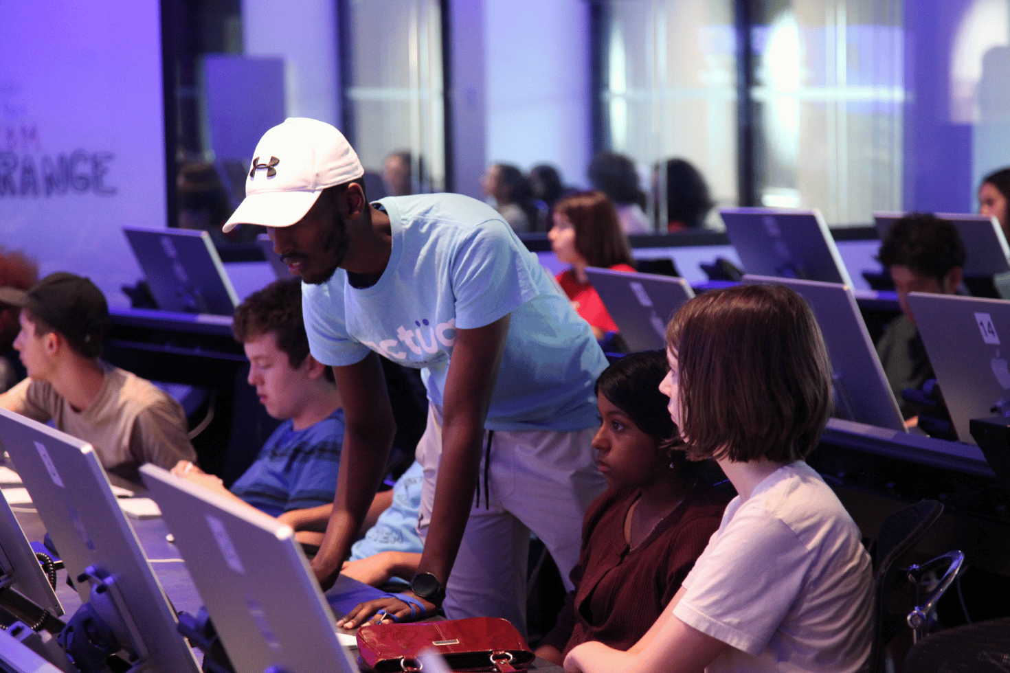 Teenagers in the Cyber Range during a cybersecurity activity.
