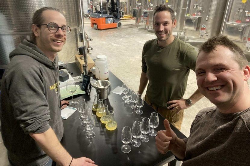 Lessard and his team working with wine.