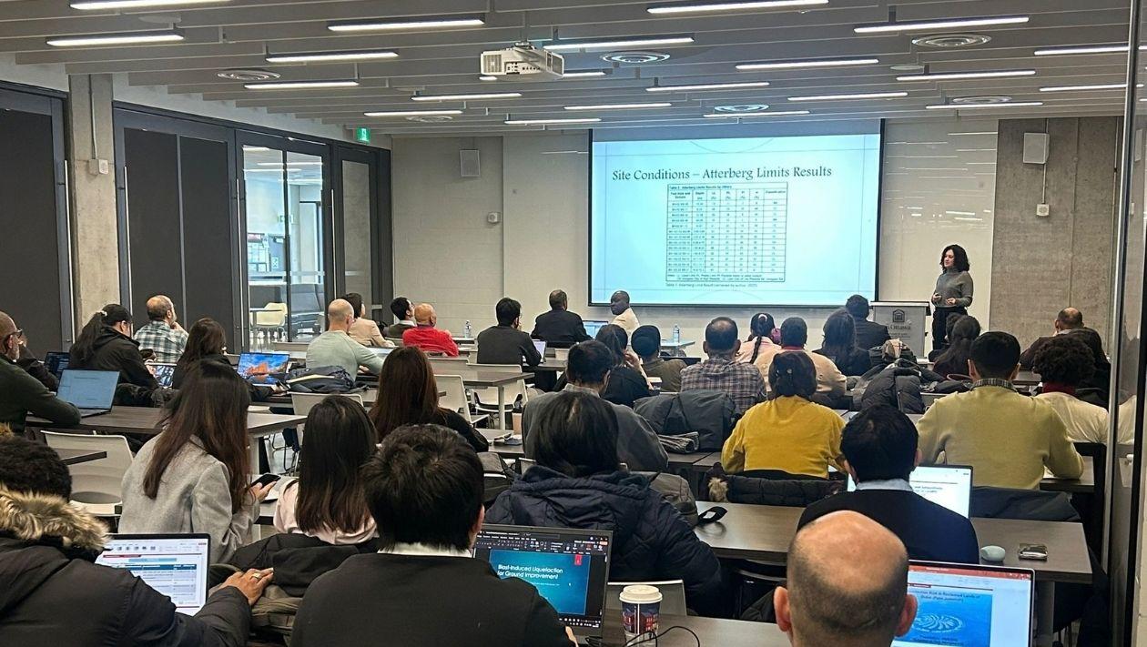 GH-RISKS conference audience viewing presentation.