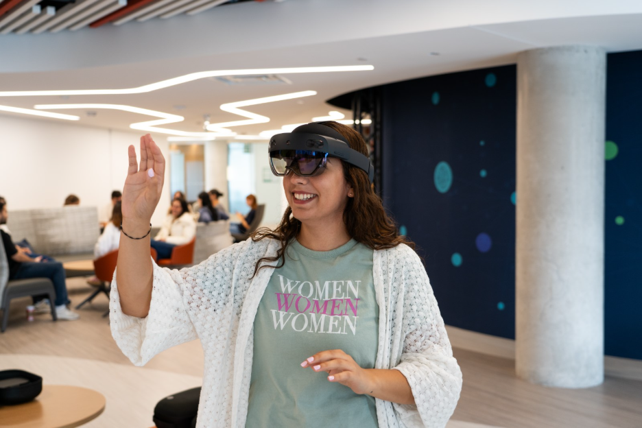 Person wearing virtual reality goggles and experiencing the VR. 