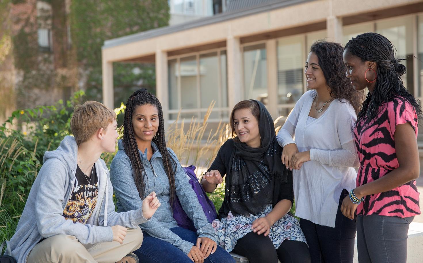 Group of students talking outside 