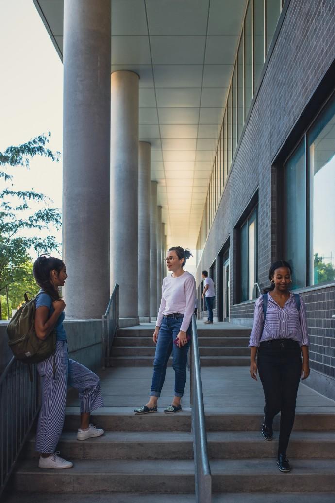 Students standing near a building