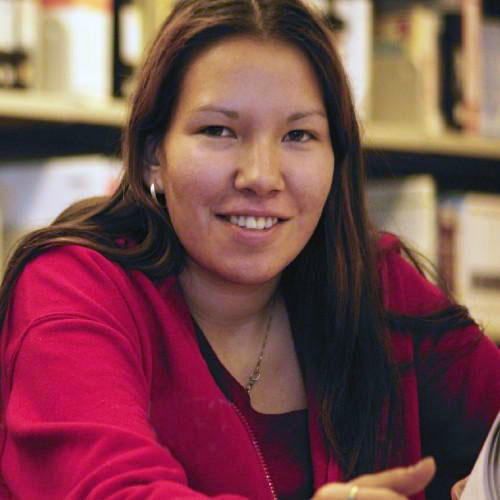 indigenous woman studying in the library