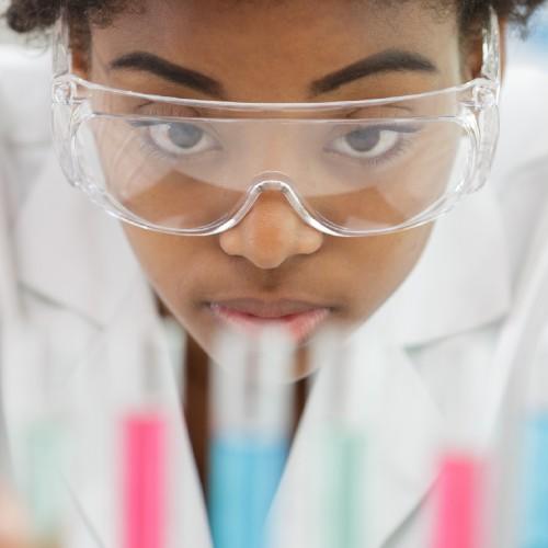 Woman with glasses holds samples in her hands