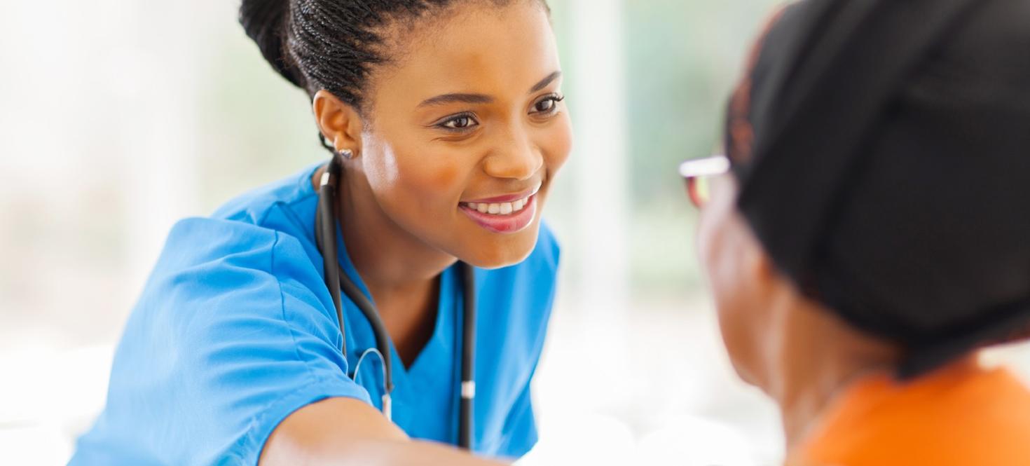 Female nurse helping a patient