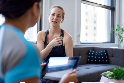A mental performance coach sees a client in an office