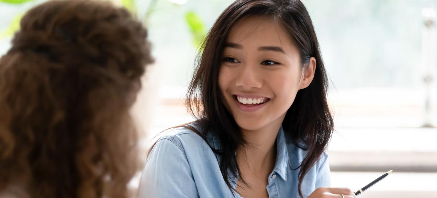 A student mentor talks to a student