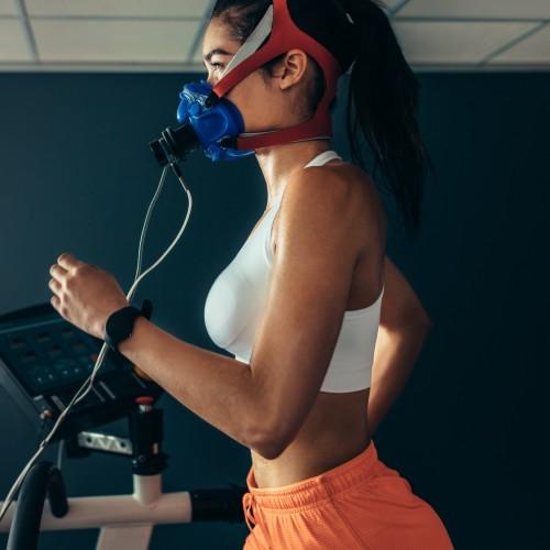 girl running on a treadmill with sensors