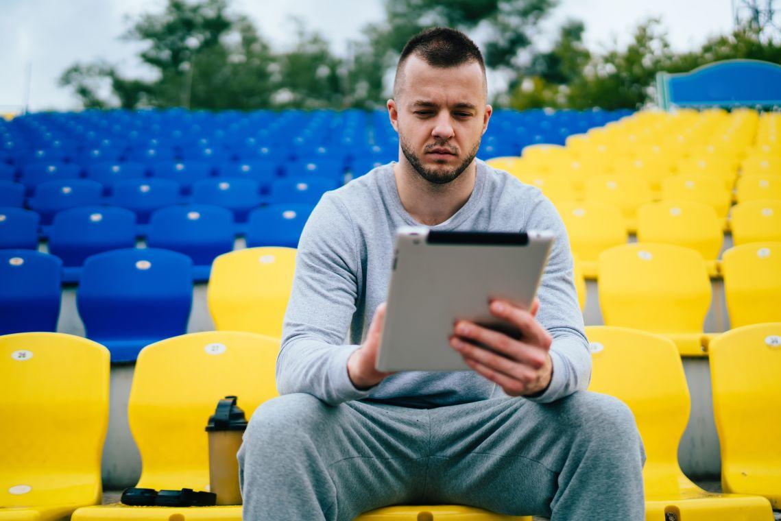 sports manager sitting