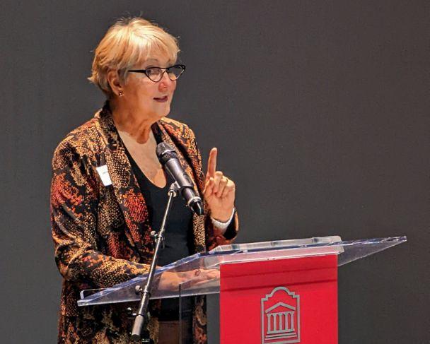 Professor Garcia presenting at the podium