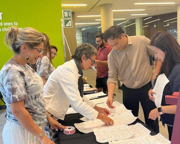 Conference attendees discussing near the registration table