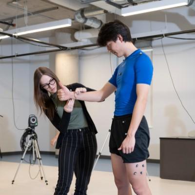 woman putting sensors on a man's skin