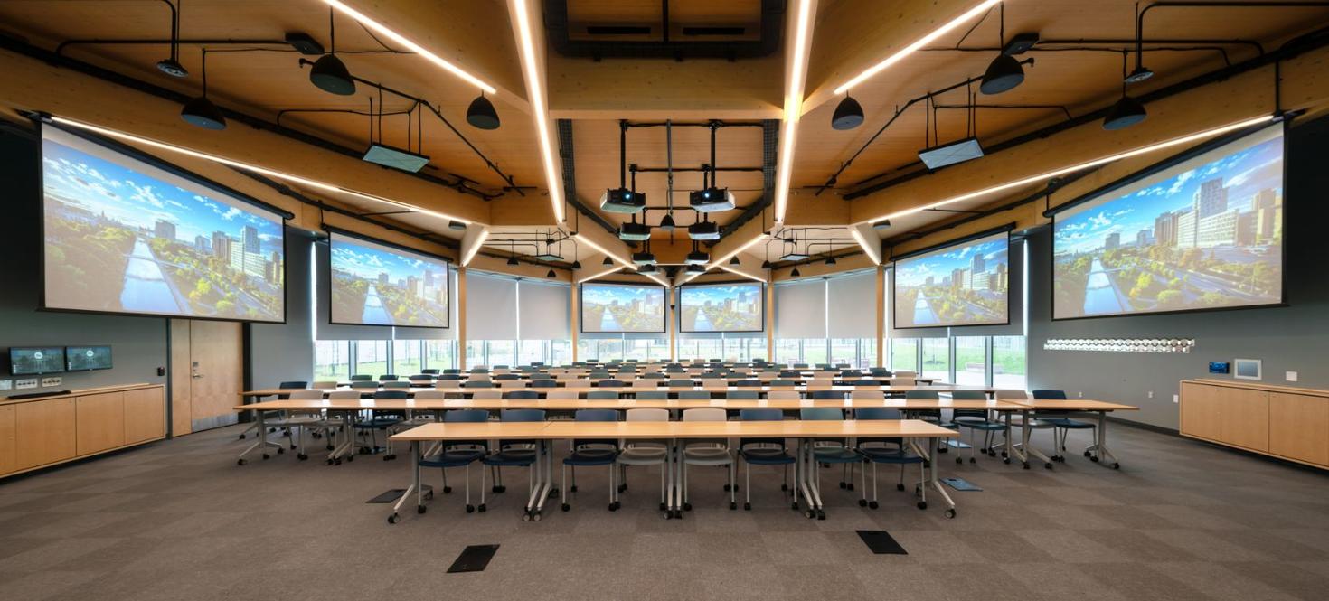 Classroom with numerous screens and windows