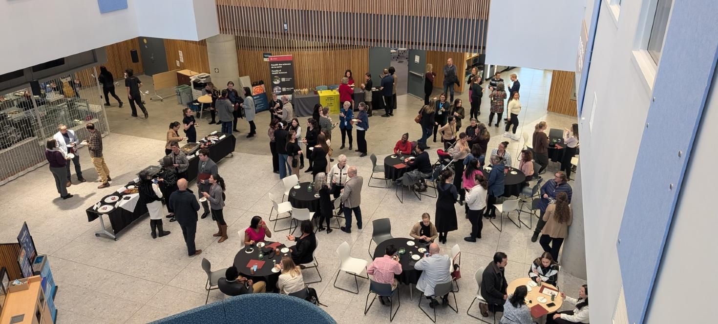 View from above of a Faculty personnel, professors and guests in the BMO Social Heart.