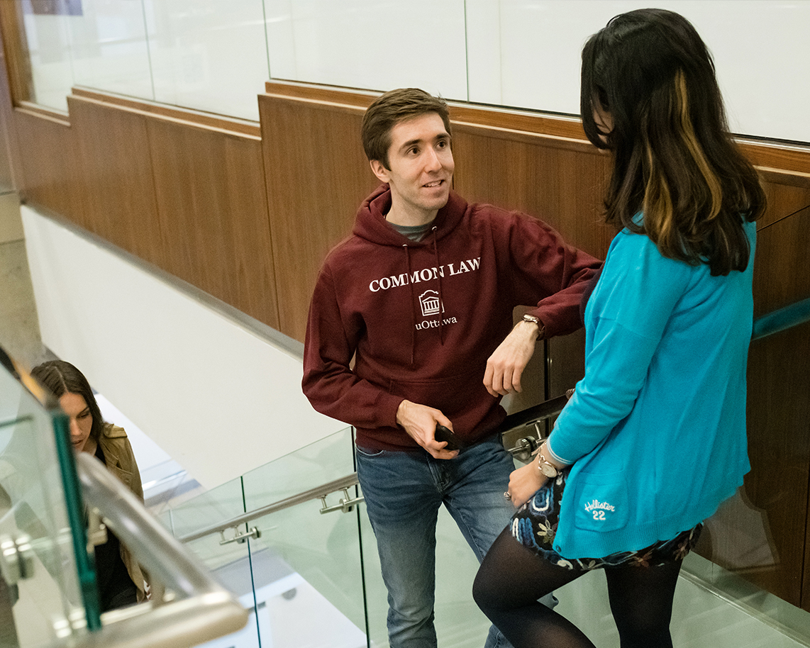 2 law students talking in stairs