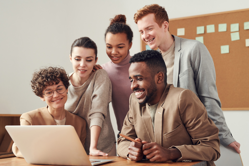 group looking at laptop
