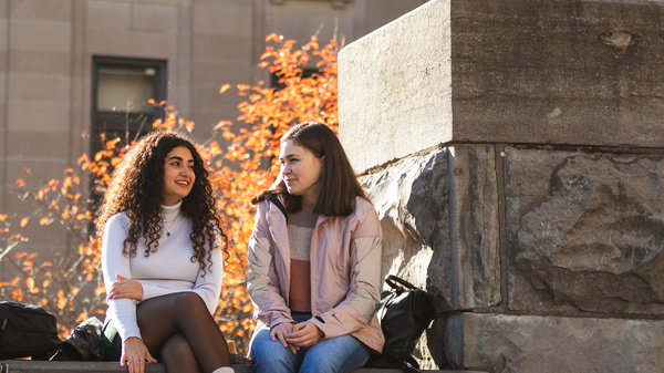 two students talking in Tabaret stairs