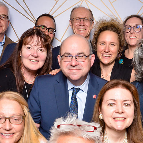 various alumnis from 2019 in a photobooth