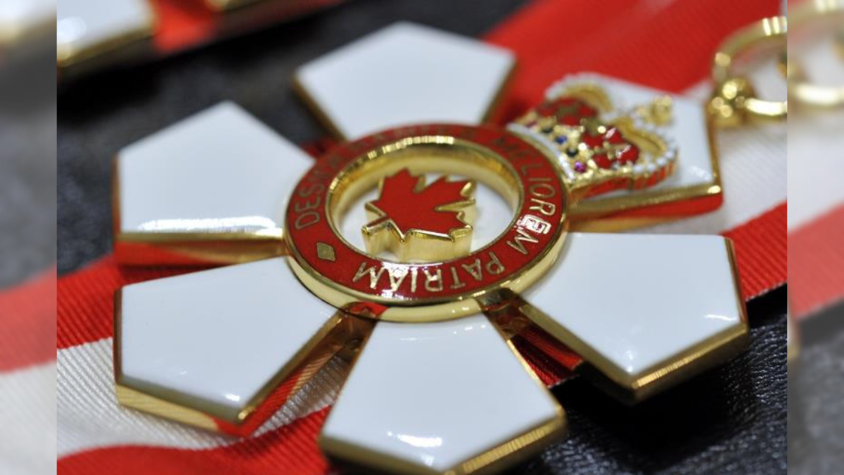 Medal of the Order of Canada on red and white ribbon