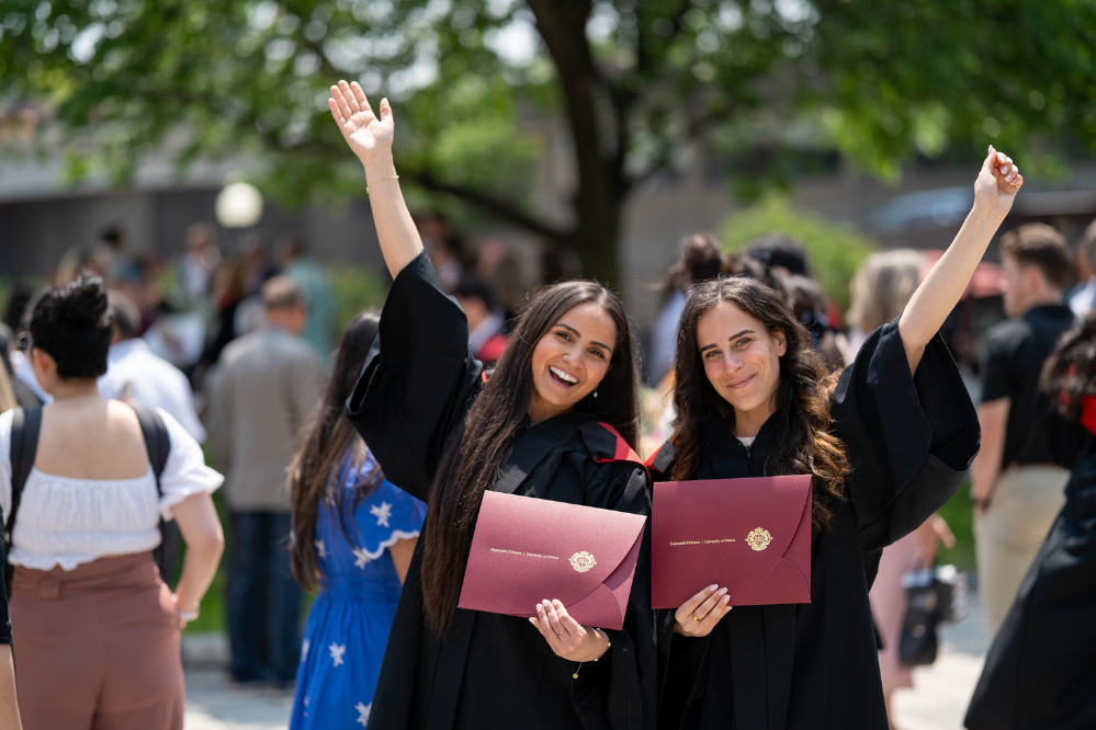 Student with diplomas