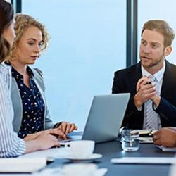 three persons in meeting