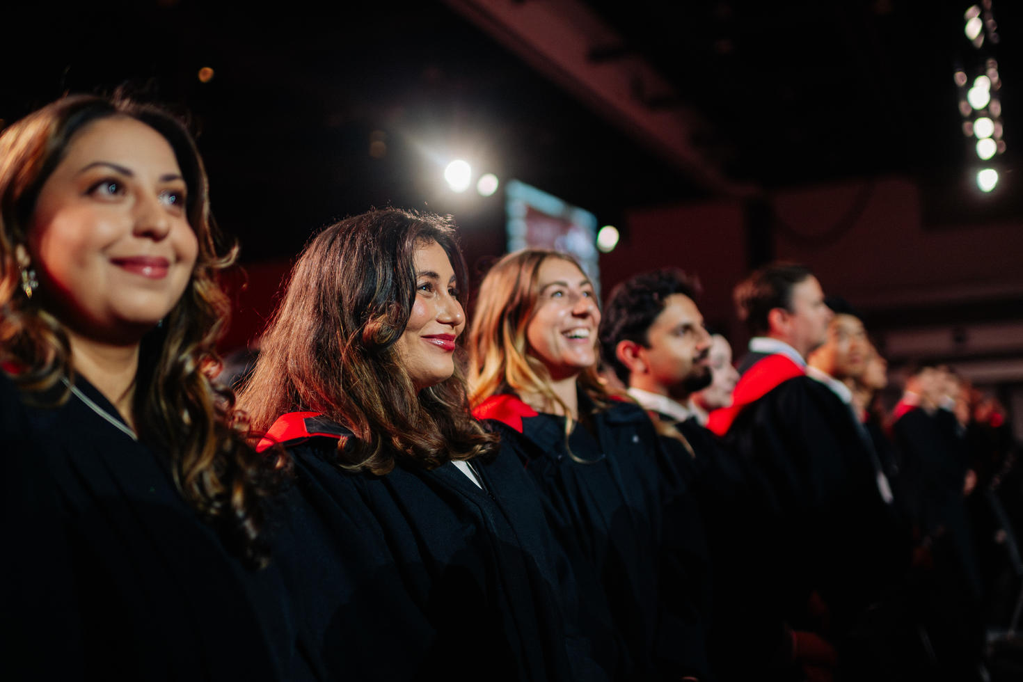 Student Graduation attendees sitting in the crowd